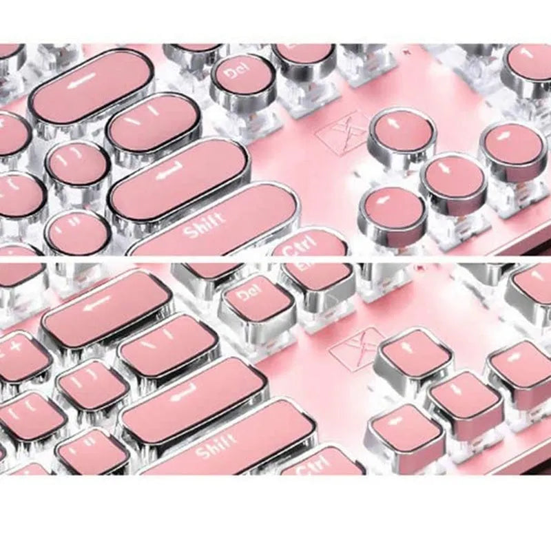 Pink and silver wired mechanical keyboard with green switches and matching mouse on a desk.