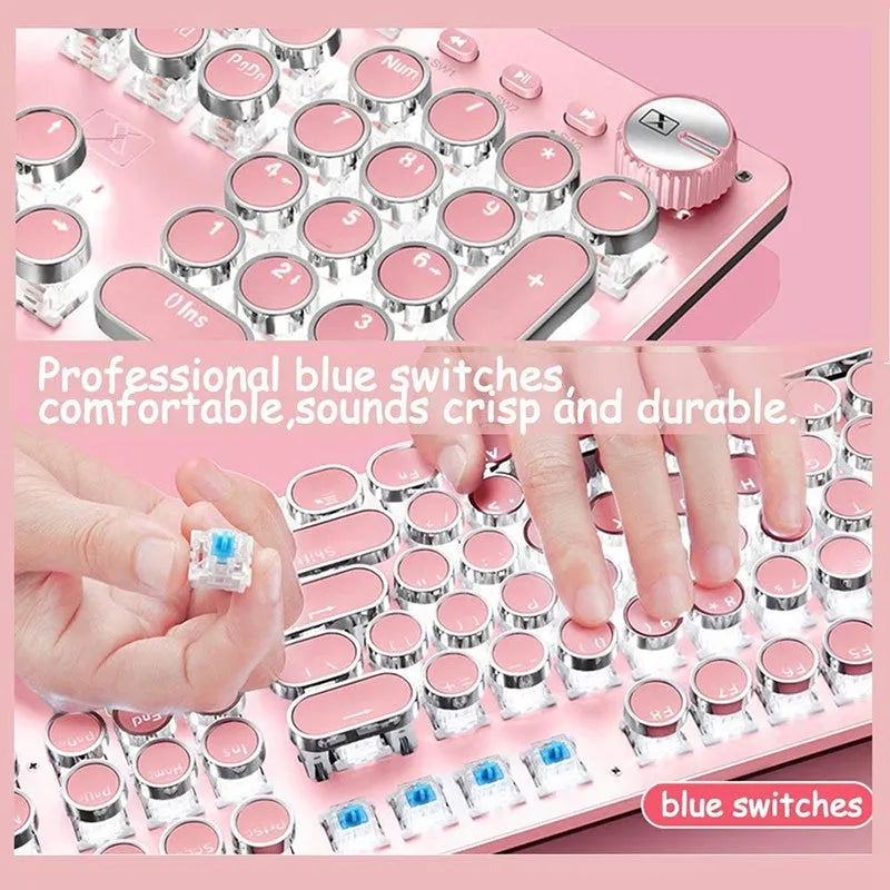 Pink and silver wired mechanical keyboard with green switches and matching mouse on a desk.