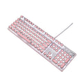 Pink and silver wired mechanical keyboard with green switches and matching mouse on a desk.