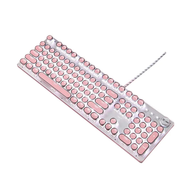 Pink and silver wired mechanical keyboard with green switches and matching mouse on a desk.