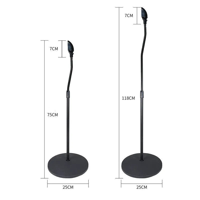 A black universal satellite speaker stand bracket on a shelf, next to an iPhone.