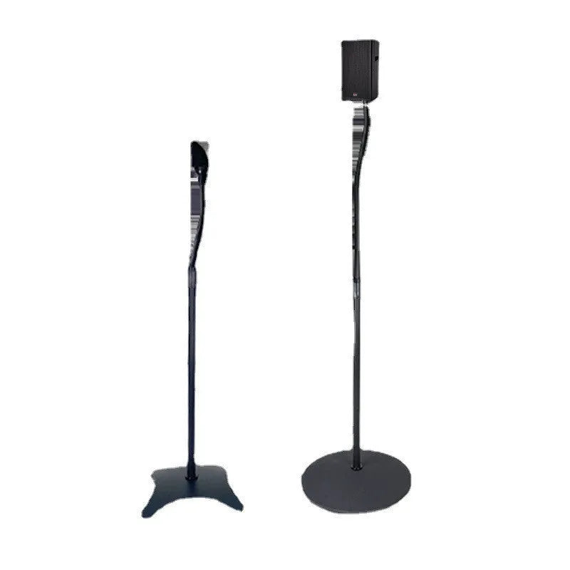 A black universal satellite speaker stand bracket on a shelf, next to an iPhone.