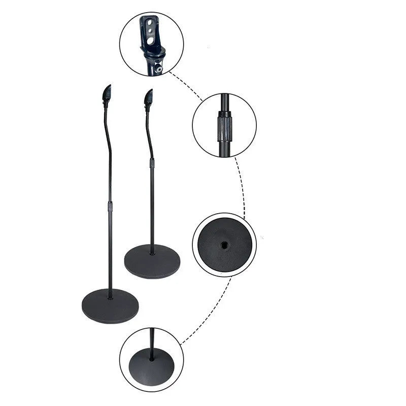A black universal satellite speaker stand bracket on a shelf, next to an iPhone.