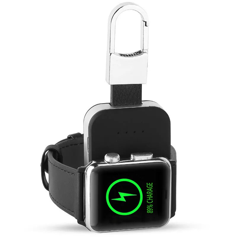 Black portable wireless power bank charger for Apple Watch on a keychain.