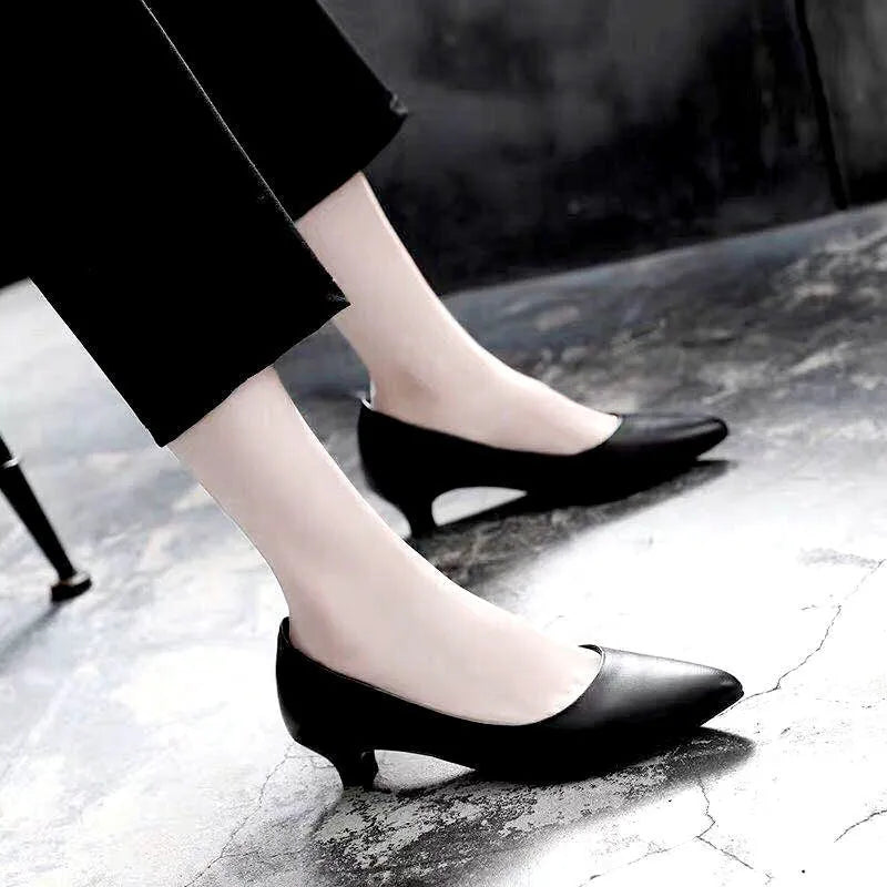 Silver and black women's wedding shoes with crystal detail and stiletto heel.