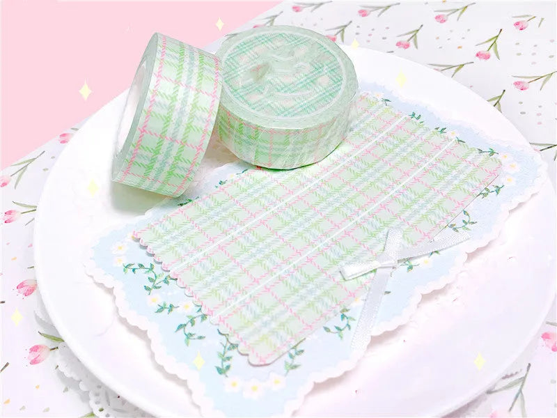 Eight rolls of decorative plaid paper tape in blue green pink purple and yellow with release paper backing 2cm x 10M