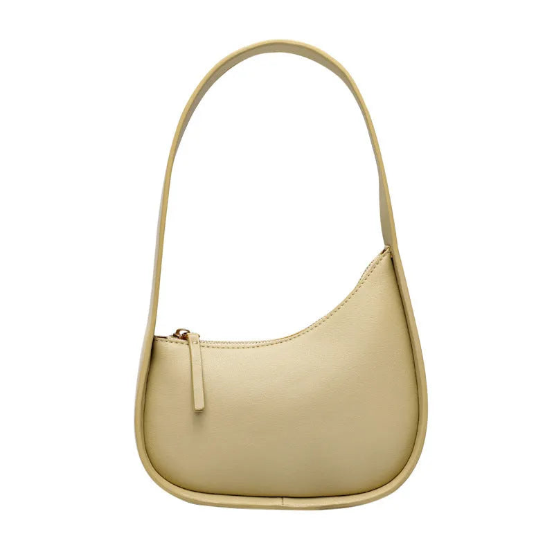 Genuine leather half moon shaped women's shoulder bag with wide strap in caramel colour