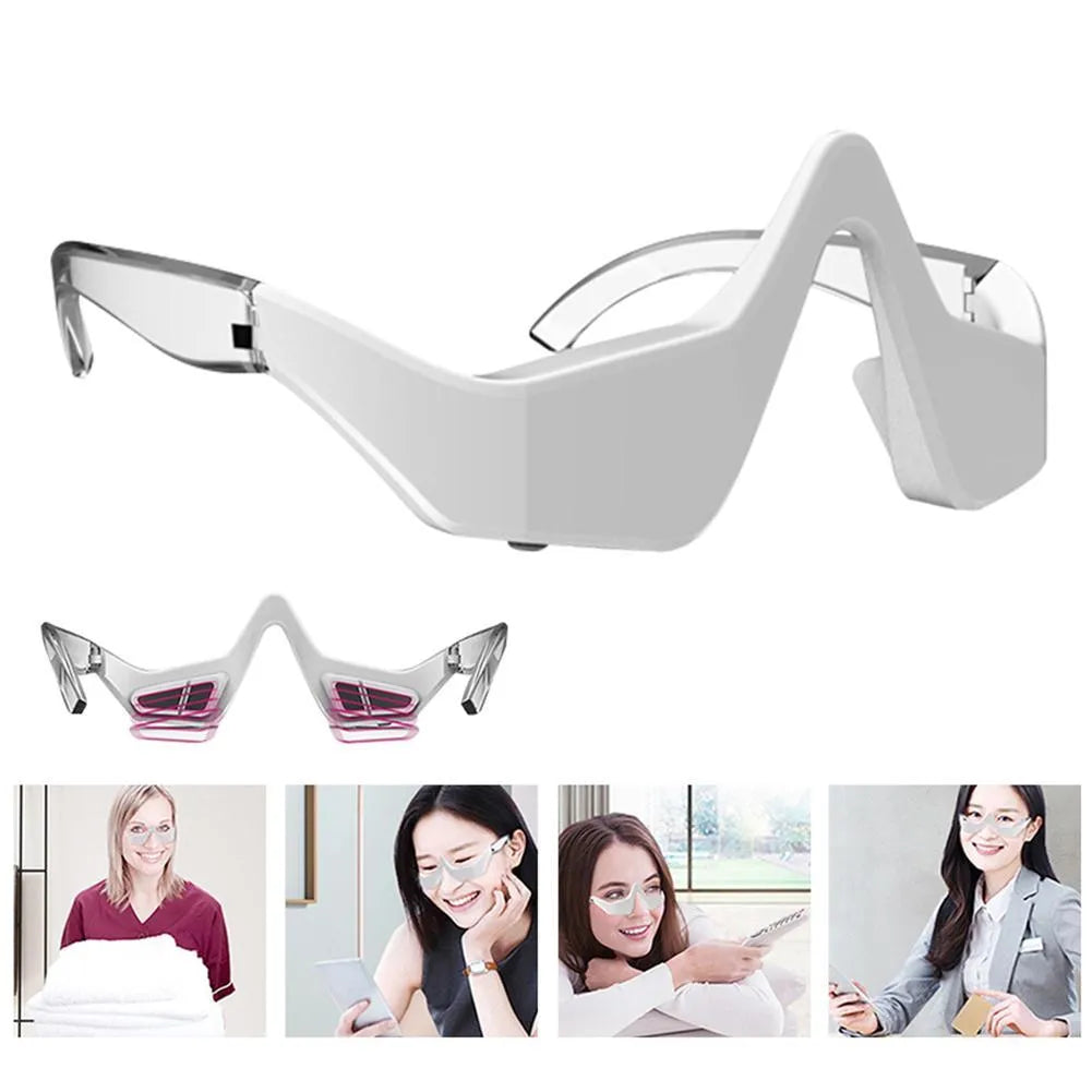Pink and white 3D micro-current eye massager shaped like glasses on a grey background.