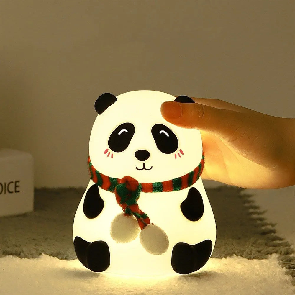 White panda-shaped silicone night light with black accents, showing its compact size and soft LED glow.