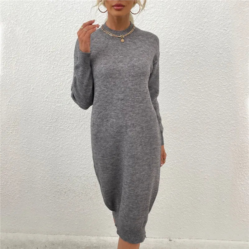 Grey women's crew neck casual acrylic sweater pullover with long sleeves laid flat.
