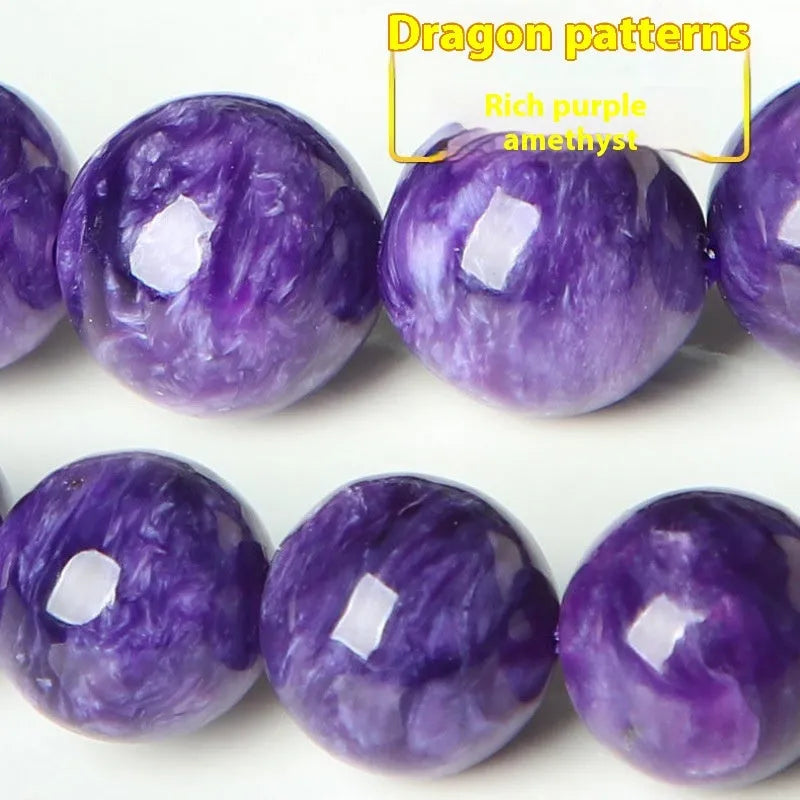 Purple charoite gemstone beaded bracelet with a platinum clasp.