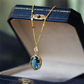Geometric gold-coloured copper pendant necklace on a chain, French retro style.