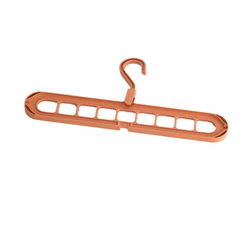 Plastic multifunctional hanger with nine holes for folding trousers in beige colour