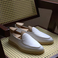 Men's handmade British brown leather loafers with a flat profile and TPR sole.