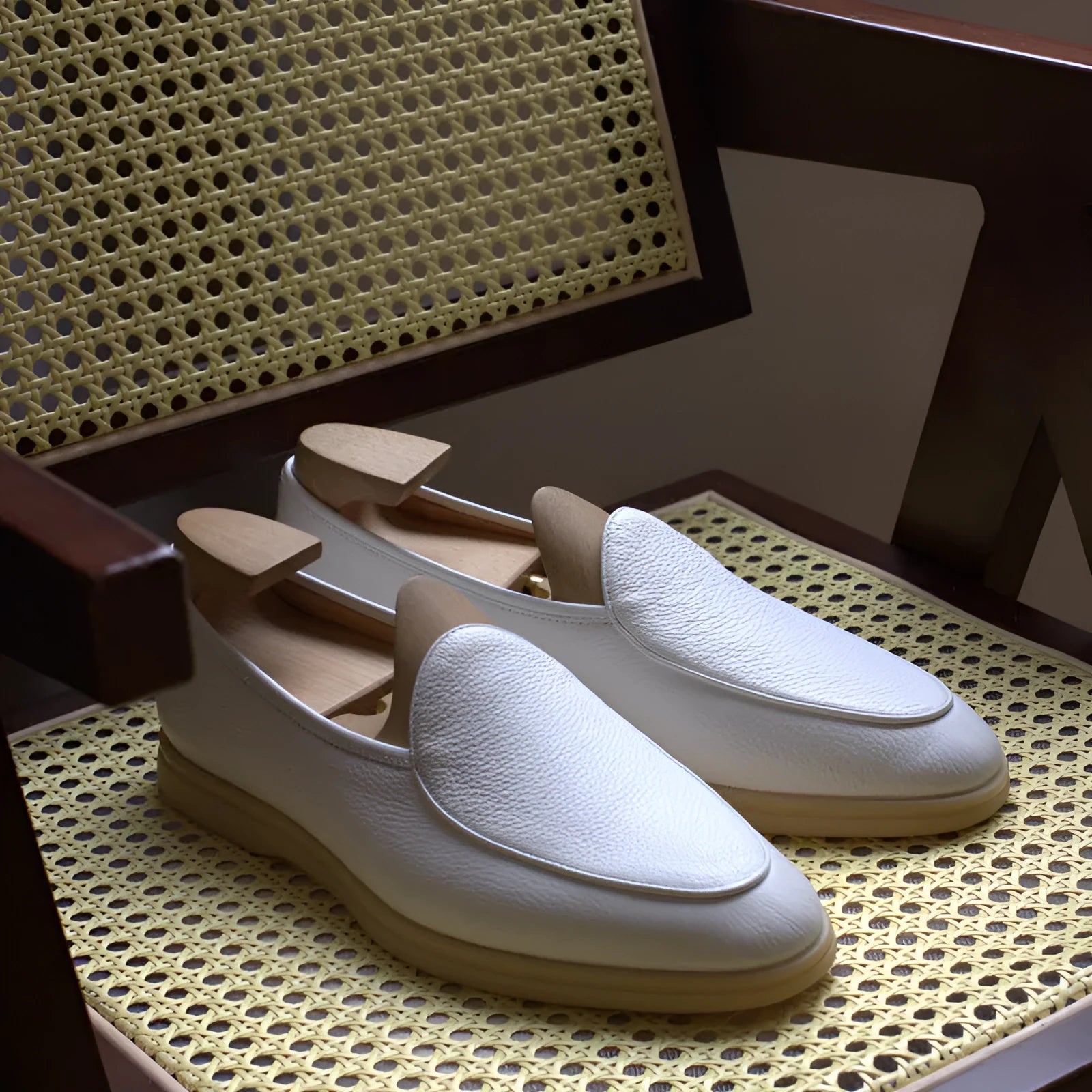 Men's handmade British brown leather loafers with a flat profile and TPR sole.