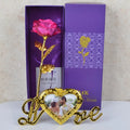 Gold-plated artificial rose with velvet stem on neutral background, available in multiple colours