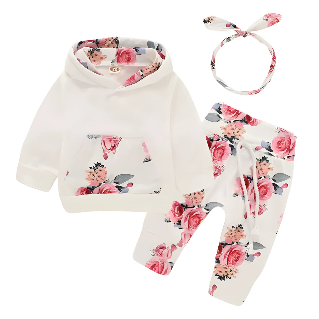 White print hooded romper suit for baby girls made from soft cotton with long sleeves and trousers.