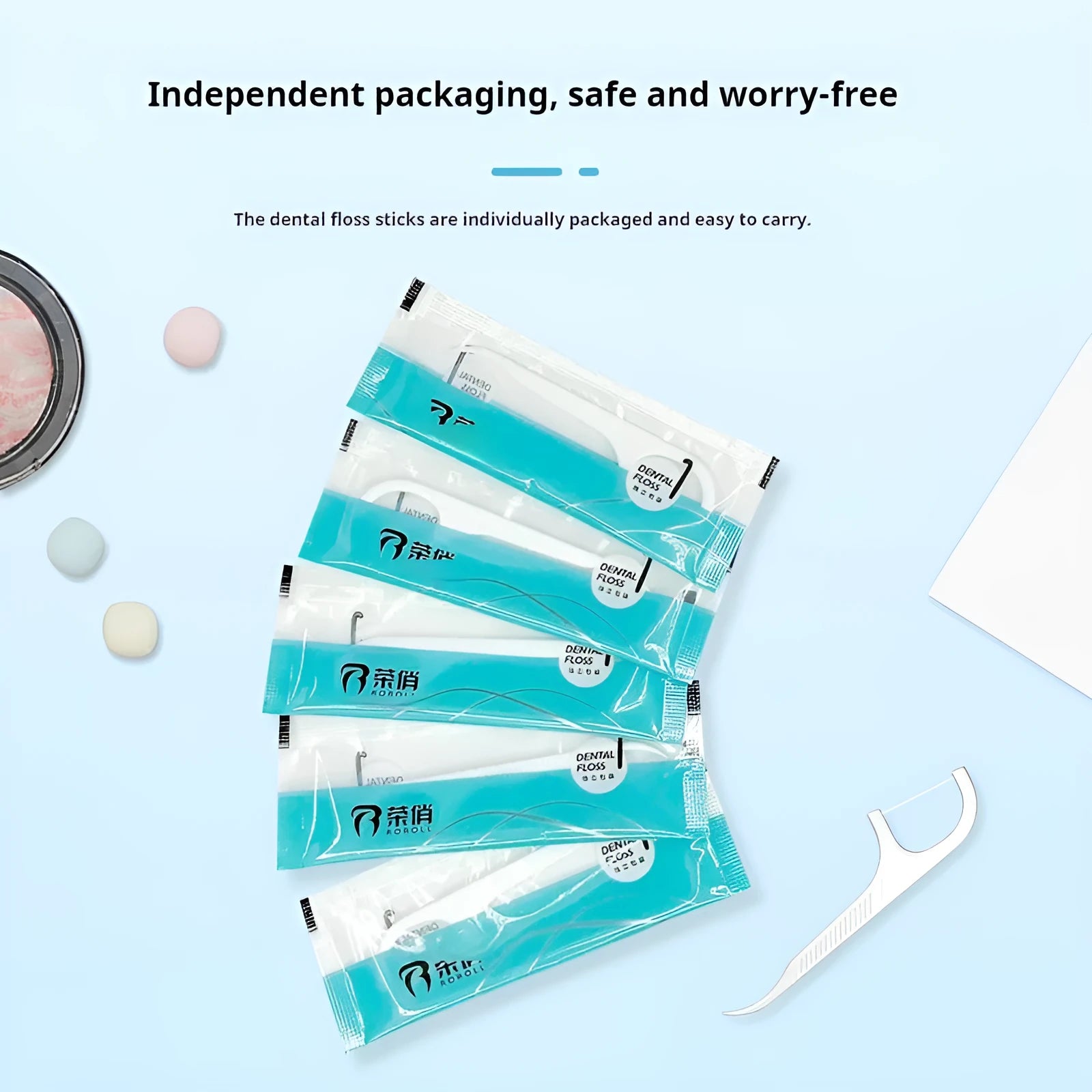 Disposable plastic dental floss bags with independent packaging, showing 100 pack offer and 180 x 238 mm size.