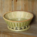 Handmade natural bamboo storage basket with open weave design in three size variations