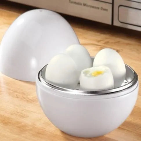 White egg-shaped microwave cooker for boiling up to four eggs, showing vent hole and knob.