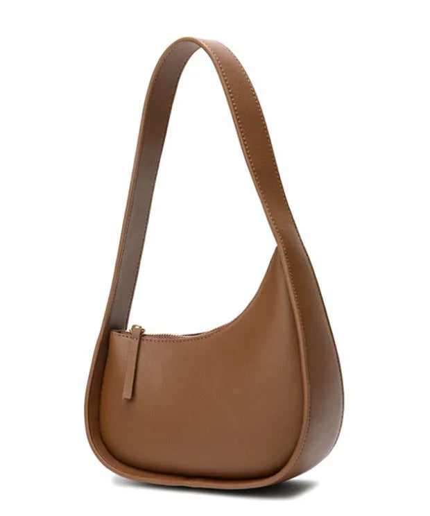 Genuine leather half moon shaped women's shoulder bag with wide strap in caramel colour