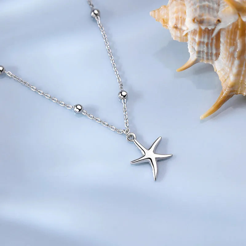 S925 sterling silver anklet with a starfish charm and round beads.