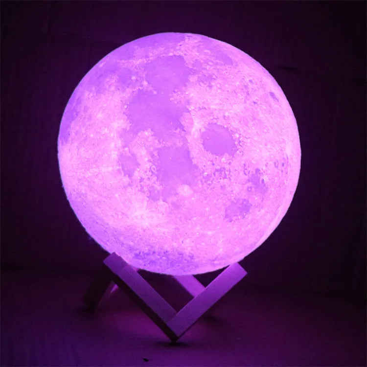 3D printed white moon lamp with textured surface on a wooden stand, showing touch ring at base