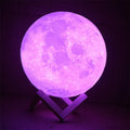 3D printed white moon lamp with textured surface on a wooden stand, showing touch ring at base