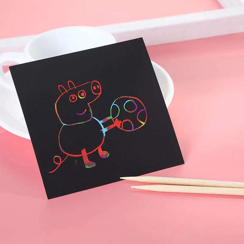 Scratch painting activity set showing colourful trumpet design on paper sheets in colour gift box