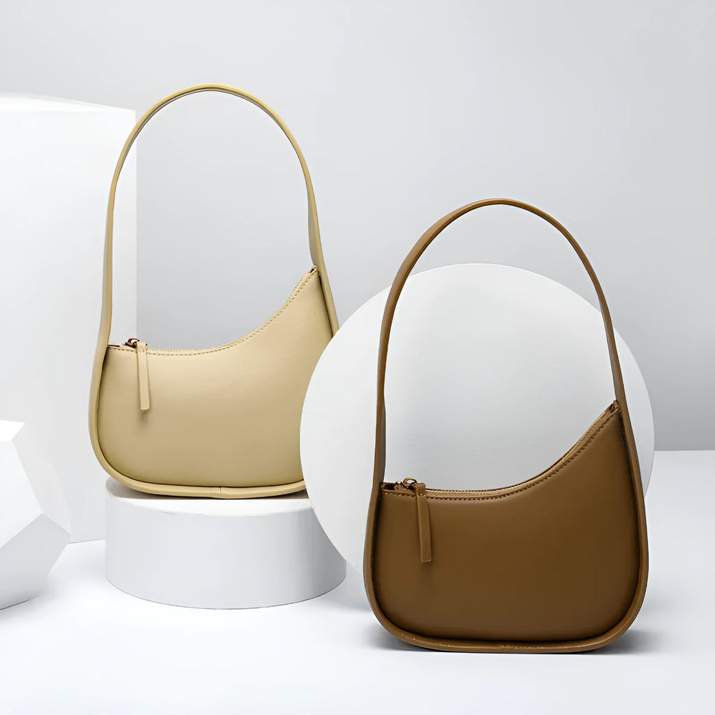 Genuine leather half moon shaped women's shoulder bag with wide strap in caramel colour