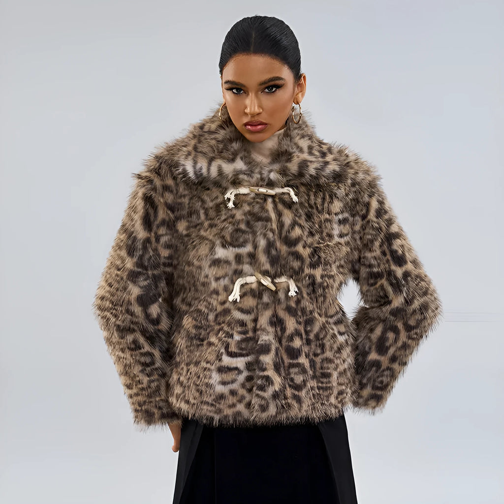Women's leopard print coat with a buckle lapel fastener on a hanger.
