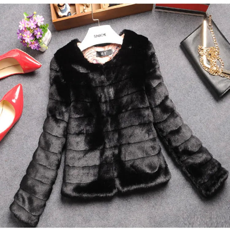 Women's short white faux fur top with regular sleeves on a hanger.