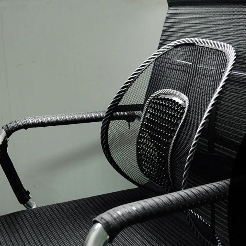 Black leather-look car lumbar support pillow with mesh panel and adjustable straps