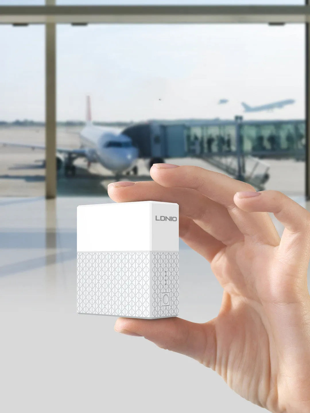 White mobile power bank charger with integrated plug showing UK, US and EU plug options