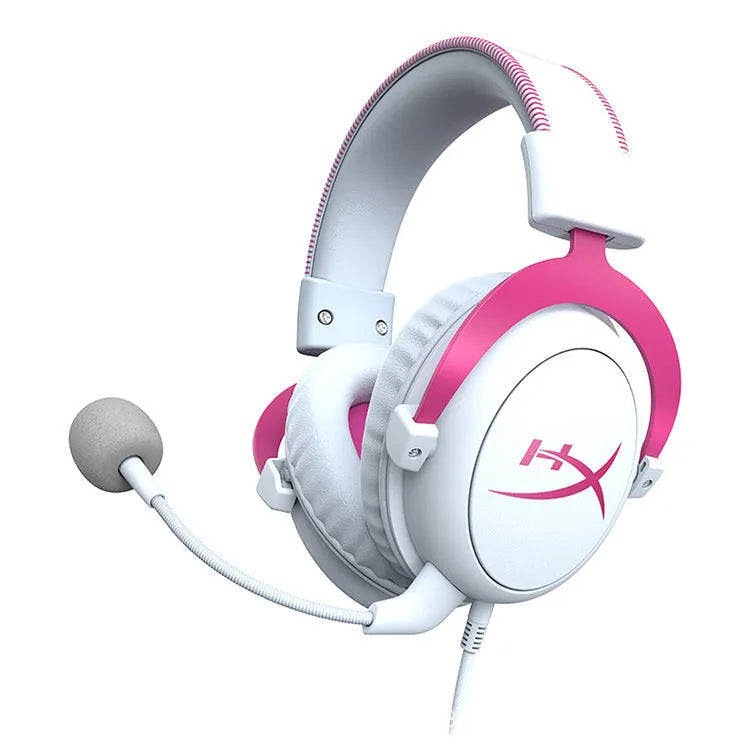 Black and red wired gaming headset with detachable microphone and separate USB sound card remote control on a desk.