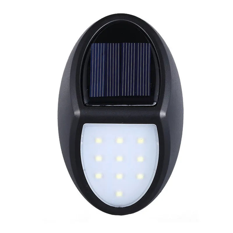 Black rectangular solar-powered LED wall light with a solar panel on top.