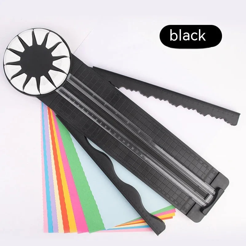 Pink plastic 12-in-1 multifunctional paper cutting machine for crafts on a white background.