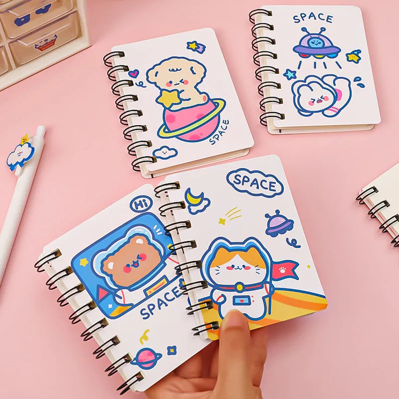 Astronaut-themed flip notebook in pocket size 10.5 by 8 cm with space cat cover design.