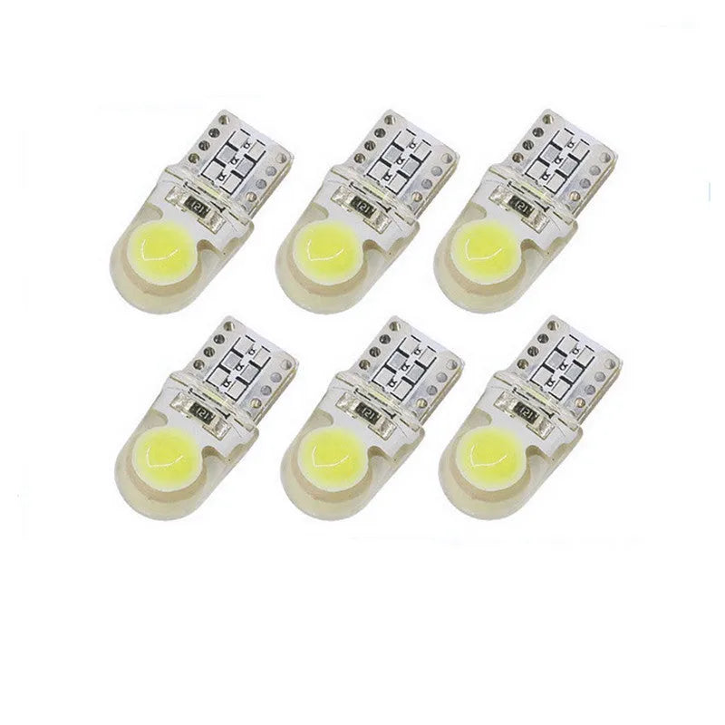 Pack of ten T10 wedge base LED bulbs for 12V car lighting in various colours on a white background.