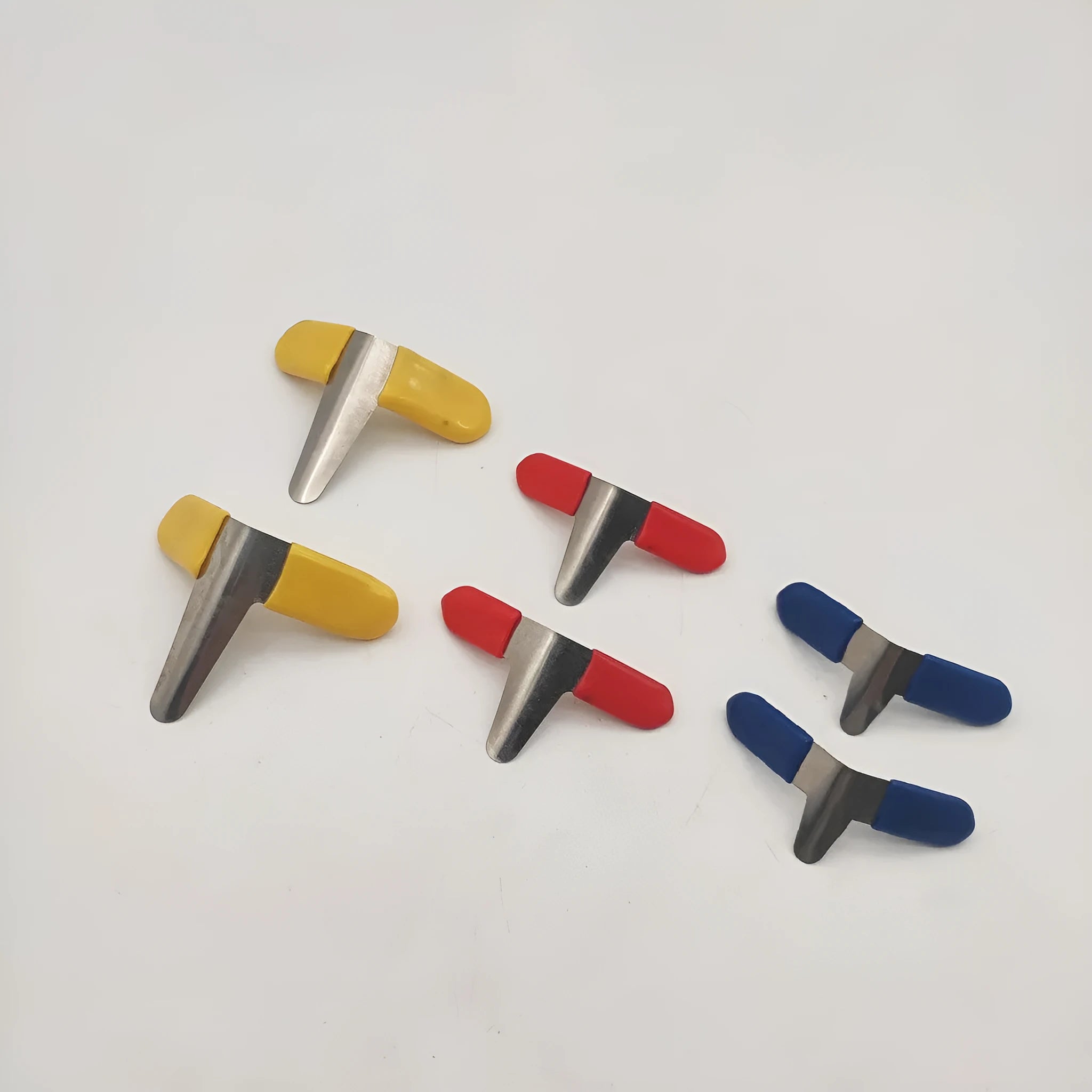 Stainless steel American-style clip locks laid out, showing the two pack options: six clips in three sizes and ten identical clips.