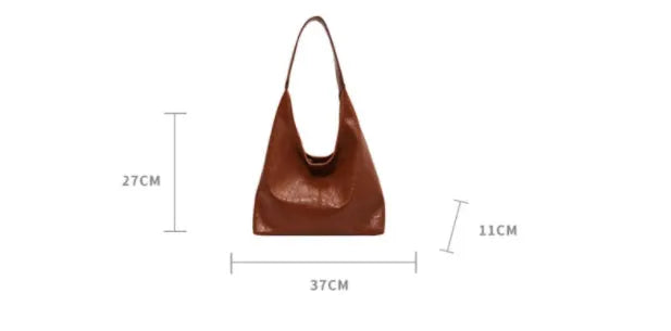 Women's casual shoulder bag in soft PU leather with sandwich pocket and visible sewing thread detail