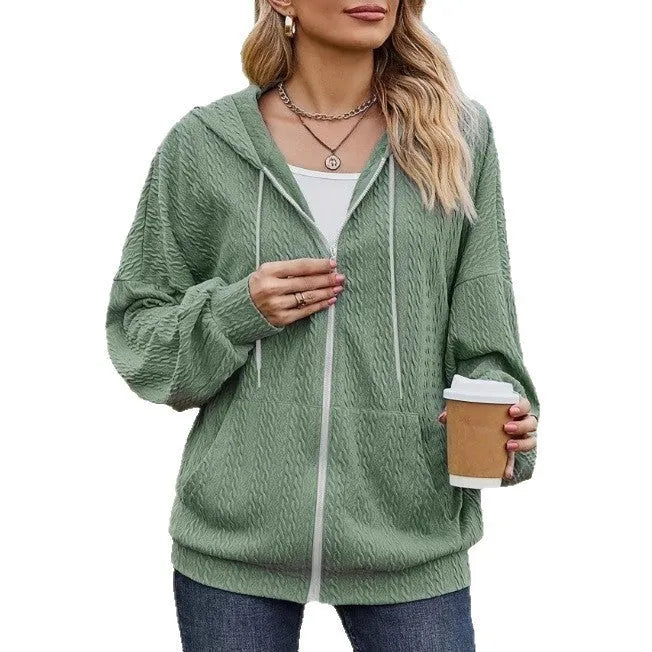 Green womens hooded zip-front sweater coat on a hanger