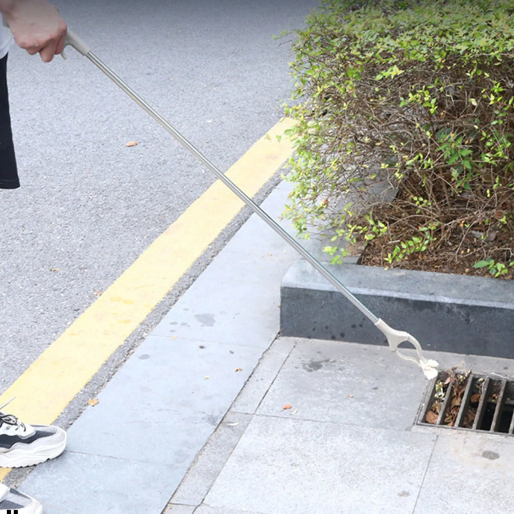 40cm long stainless steel and plastic garbage picker tool with push-type handle.
