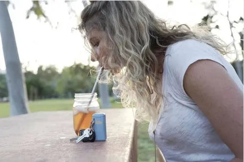 Folding reusable stainless steel drinking straw with cleaning rod and storage box in a pocket