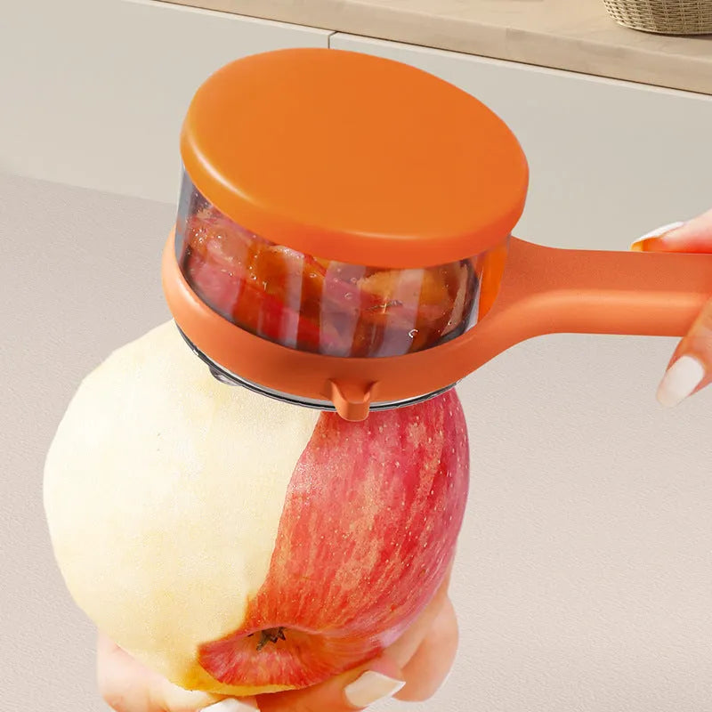 Light green plastic kitchen peeler with built-in storage bucket and scraper function.