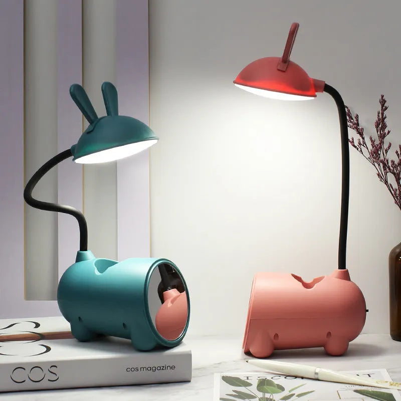 Cartoon-style USB desk lamp with integrated pen container in green colour