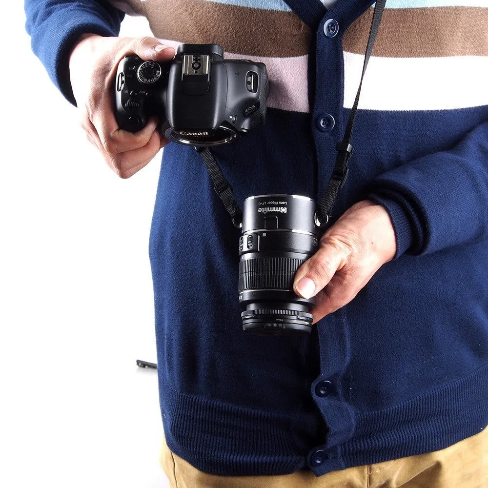 Aluminium alloy camera lens flipper holder for Nikon E-Mount with stainless steel buckle and cotton strap.