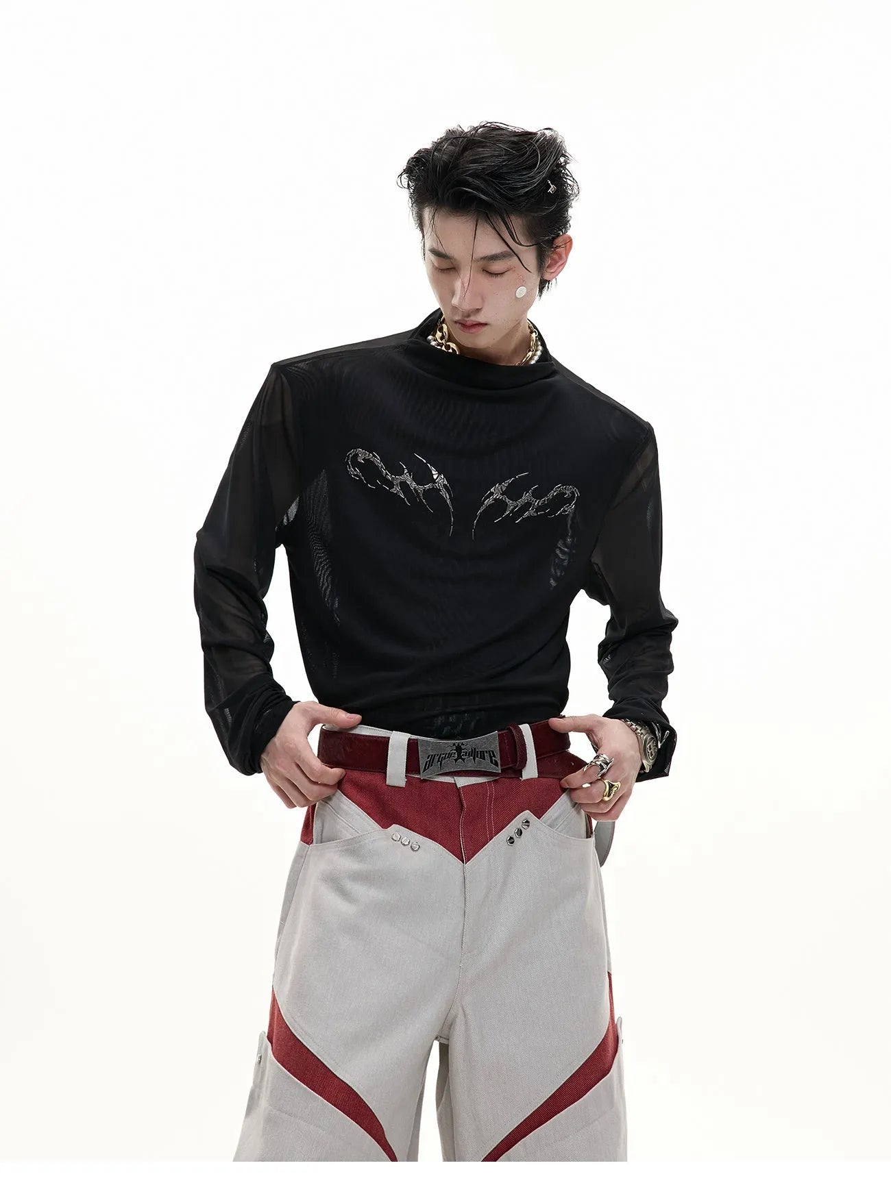Black and white long sleeve mesh slim fit shirt laid flat, showing mesh fabric texture.