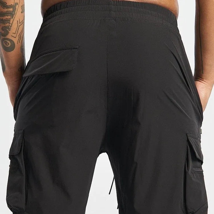 Men's black quick-dry sports shorts with elastic fabric for running and fitness activities
