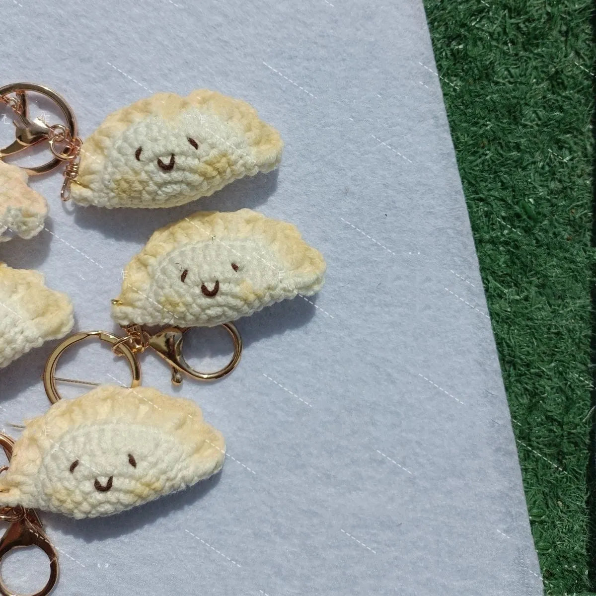 Handmade crochet dumpling pendant with plush material and keychain in traditional dough eye design